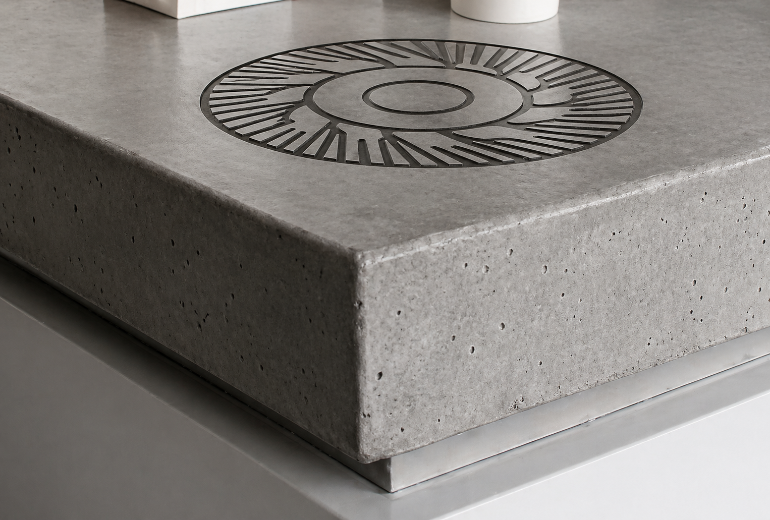 Burr-wheel motif engraved into concrete bar surface